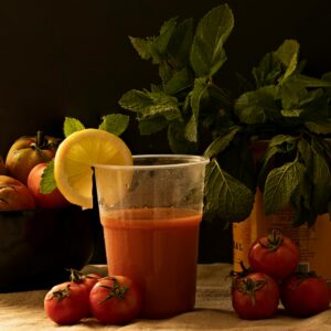 Refreshing gazpacho with fresh tomatoes, mint leaves, and lemon slice.